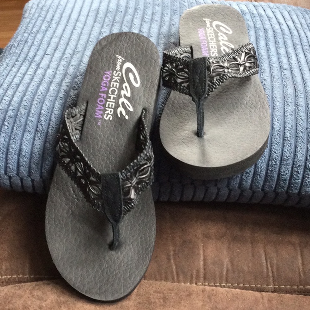 Black Skechers sandals or flip flop